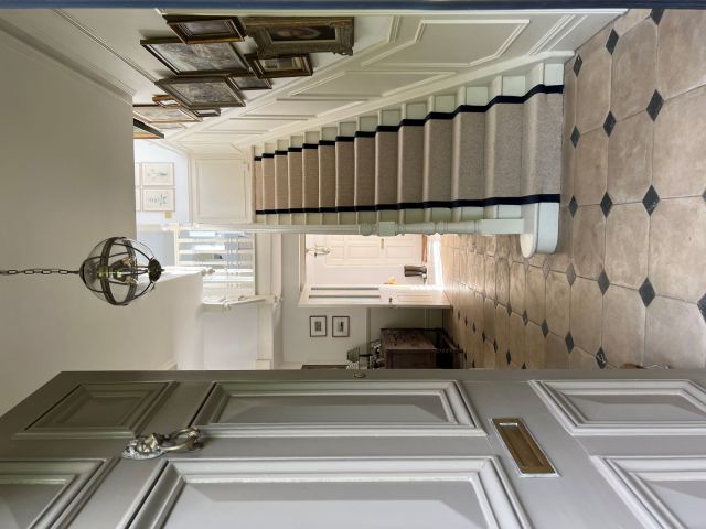 cream stair runner carpet in English country house hallway